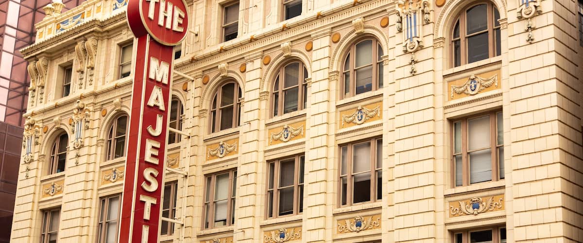 Majestic Theater featuring a city, heritage architecture and signage