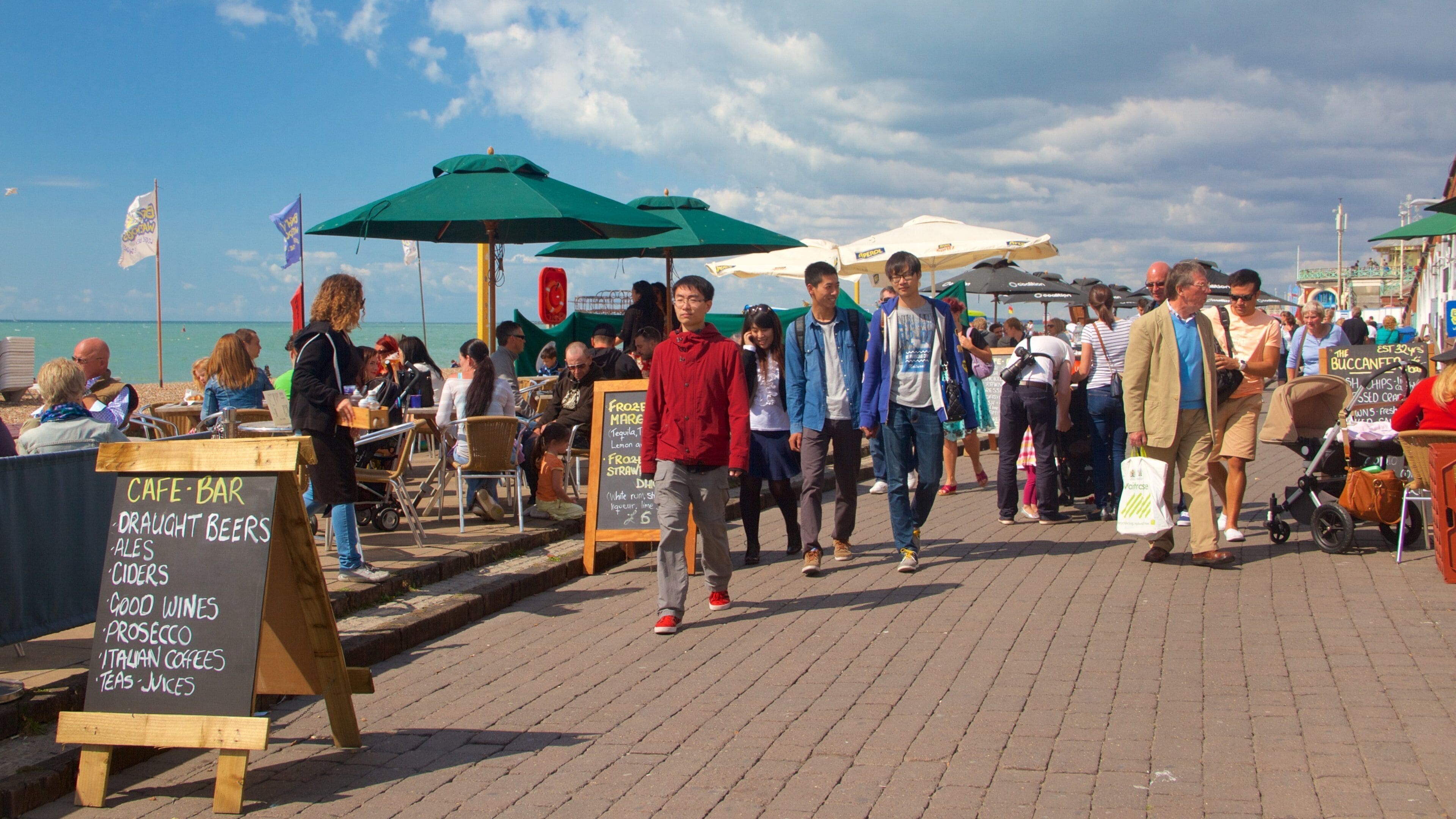 Brighton Beach featuring general coastal views, signage and outdoor eating