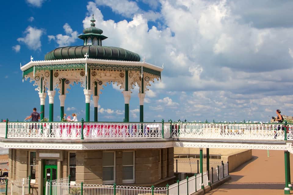 A gazebo with ornate green and white railings, a domed roof, and a sign reading "BAYVIEW".
