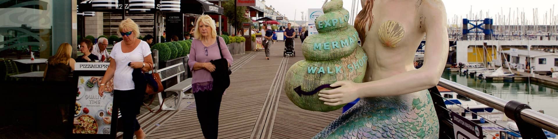 Brighton Marina featuring a marina and a statue or sculpture