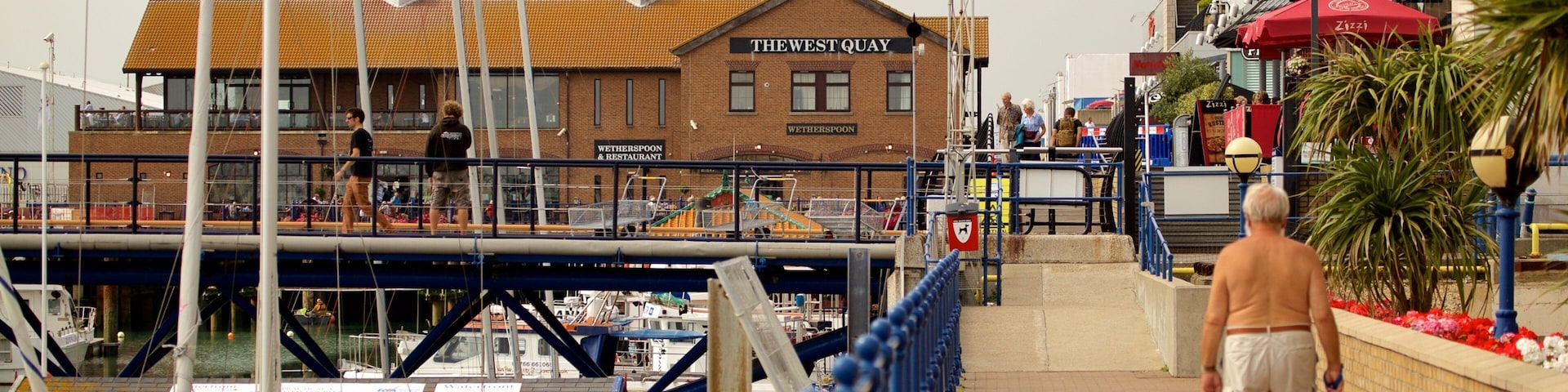 Brighton Marina showing a marina as well as an individual male