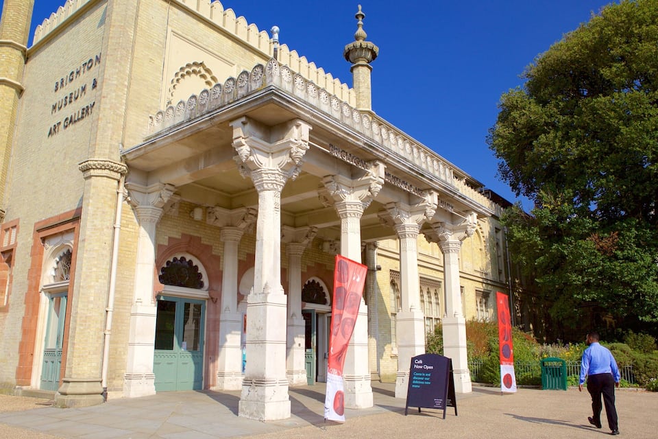A historic building with ornate columns and a clock tower.
