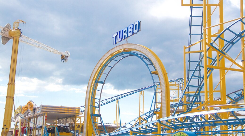 Brighton Pier showing rides