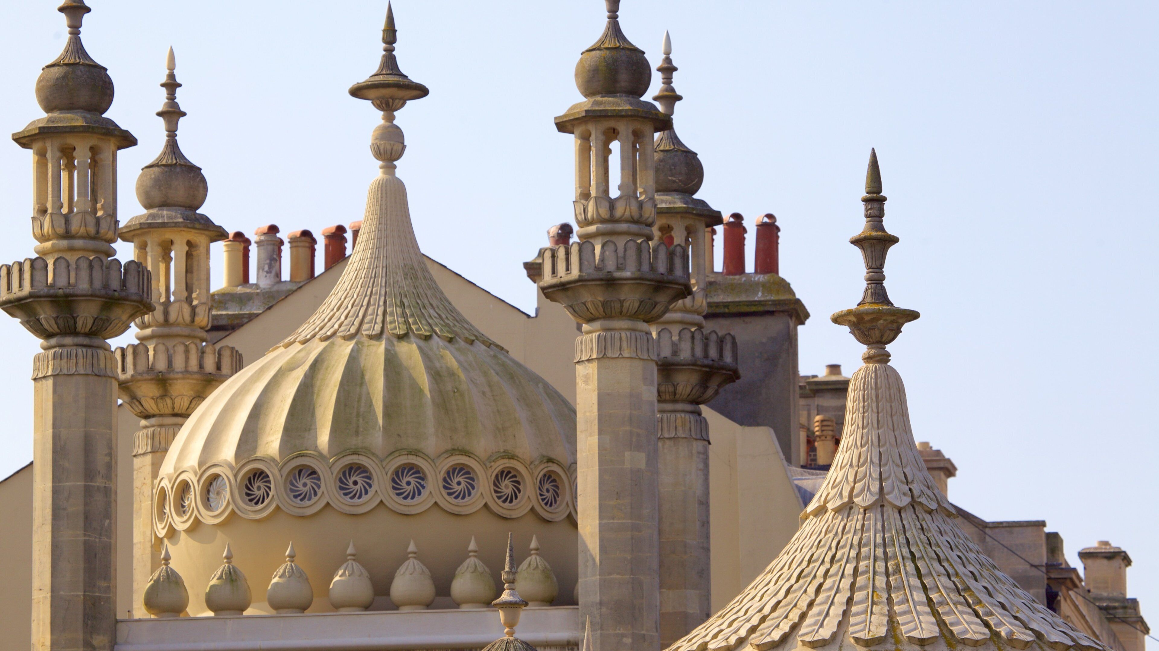 A historic building with ornate domes and spires.