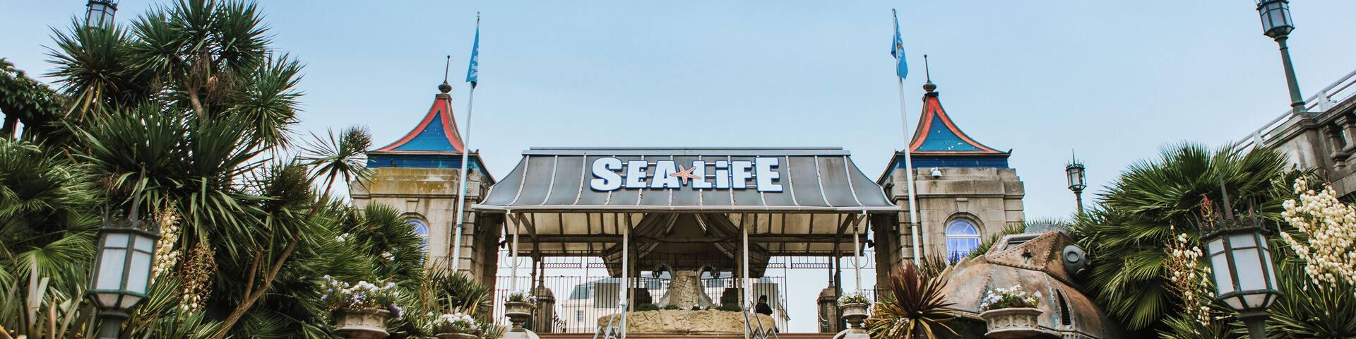 A grand entrance with steps leading up to a building labeled 'SEA LIFE'.