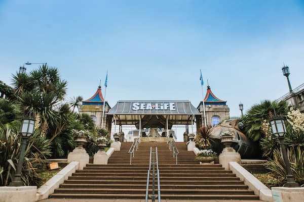 A grand entrance with steps leading up to a building labeled 'SEA LIFE'.