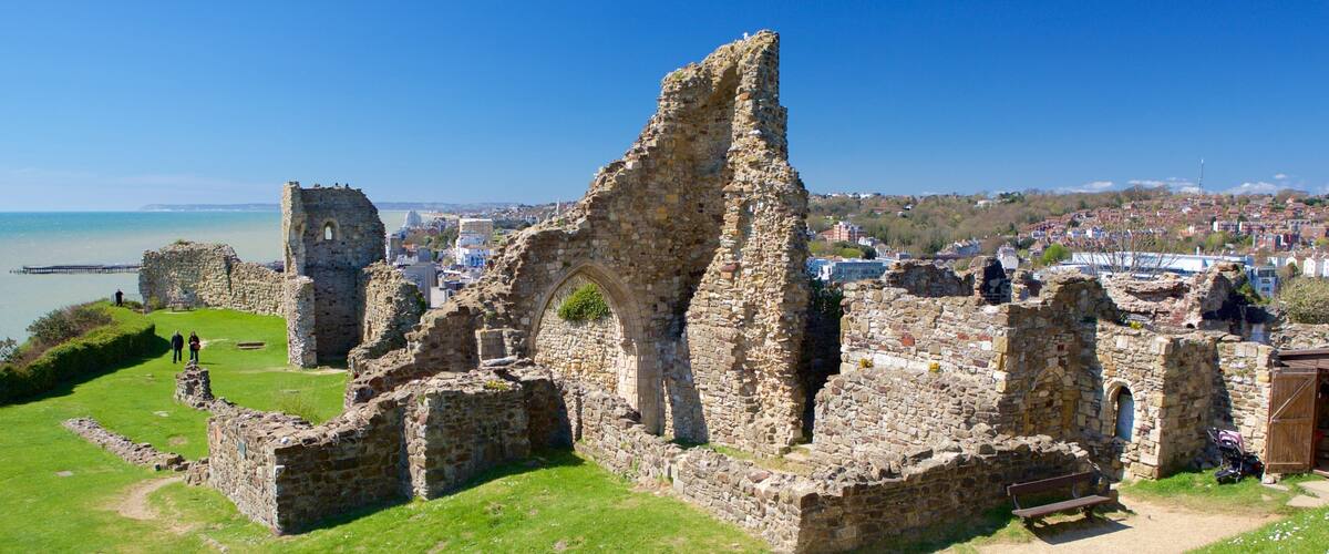 Hastings Castle featuring a ruin, heritage elements and general coastal views