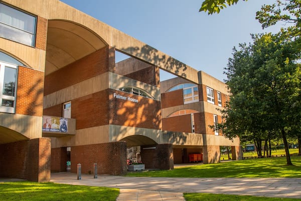 A modern building with the sign "Palmer House" on the side.