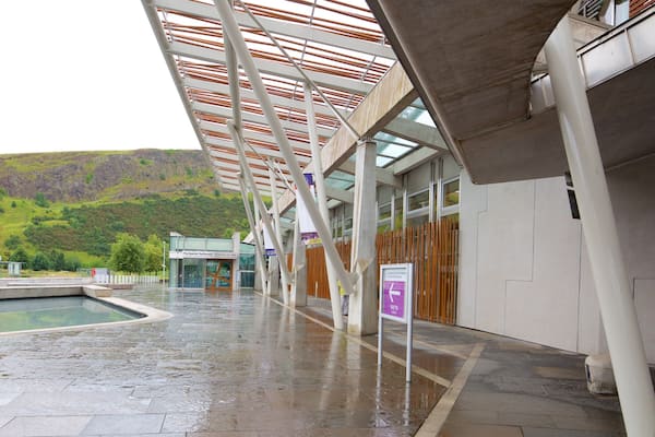 Scottish Parliament showing street scenes and a pool