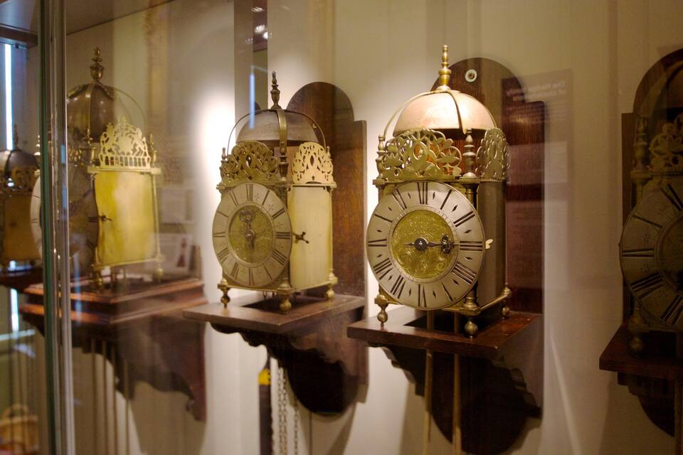 A collection of ornate antique clocks with intricate designs and Roman numerals.