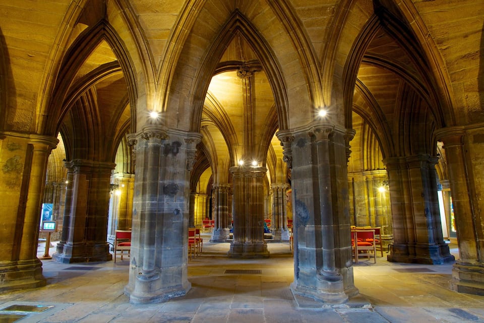 A cathedral interior with high vaulted ceilings and Gothic arches.