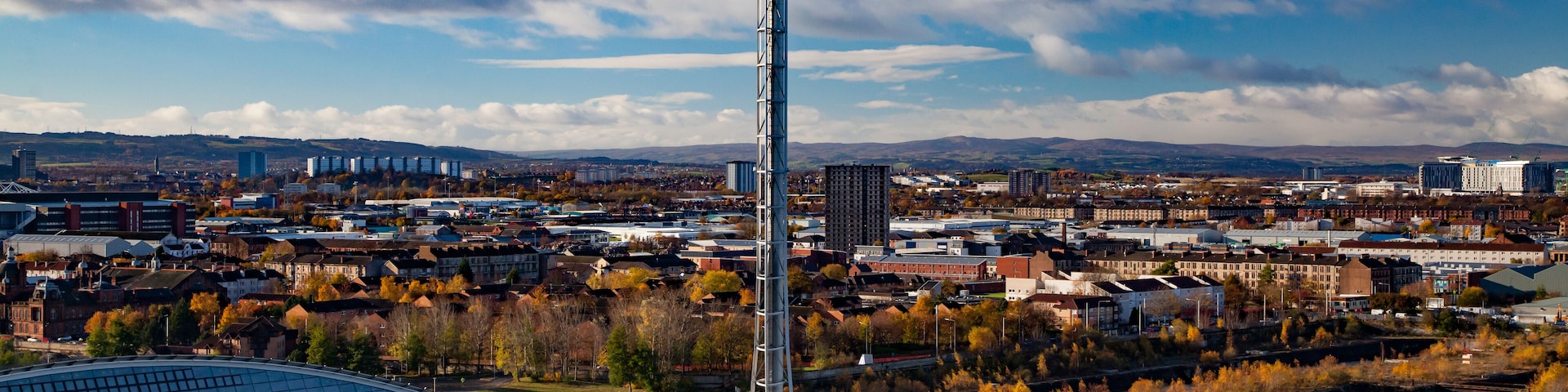 Glasgow, Scotland, Nov 13, 2013: Clyde river embankment and Glasgow Science Centre and Tower. Steam ship. (Paddle-wheel steamer). Blue sky with clouds.