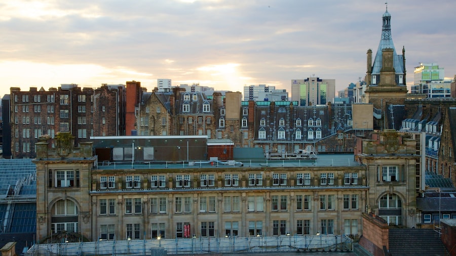 Lighthouse showing a city, heritage architecture and a sunset