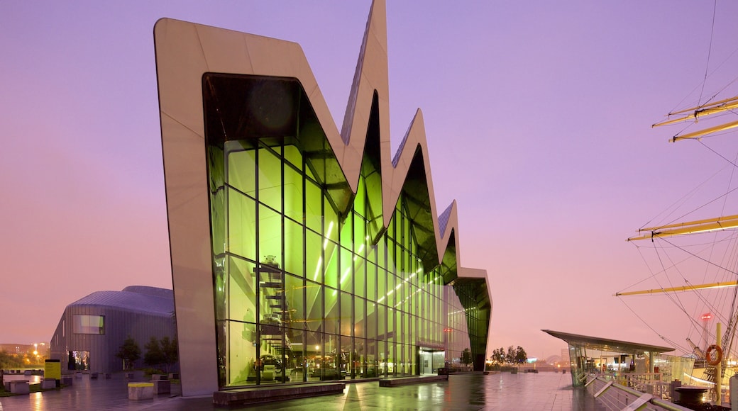 Riverside Museum featuring modern architecture, a sunset and mist or fog