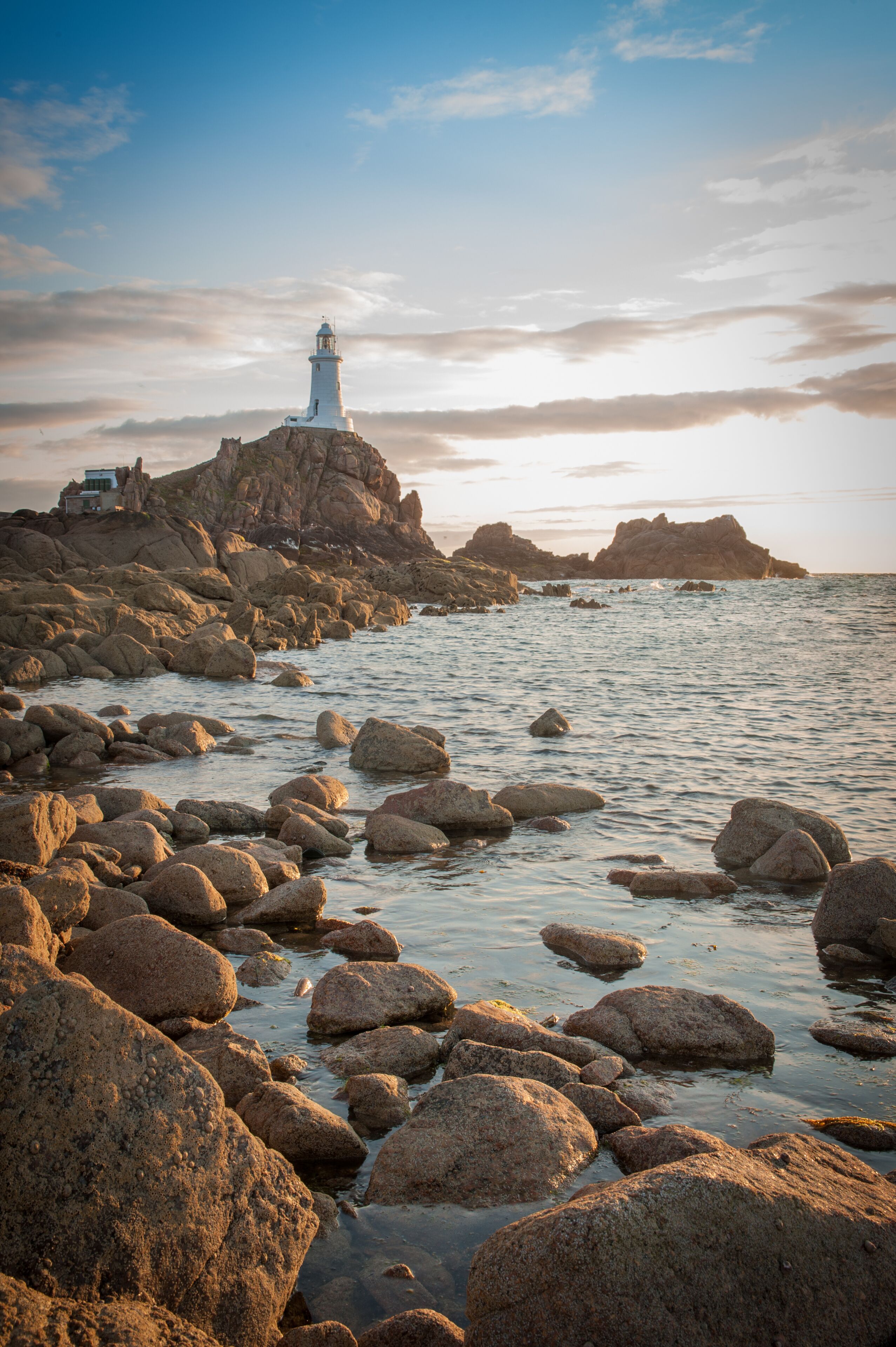 La Corbiere Lighthouse at sunset on Jersey in the Channel Islands, in the English Channel.