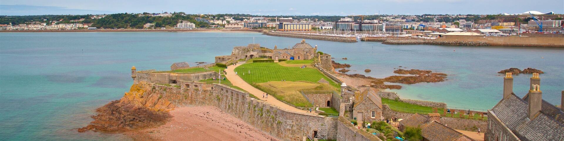A coastal fortification with a beach and a harbor.