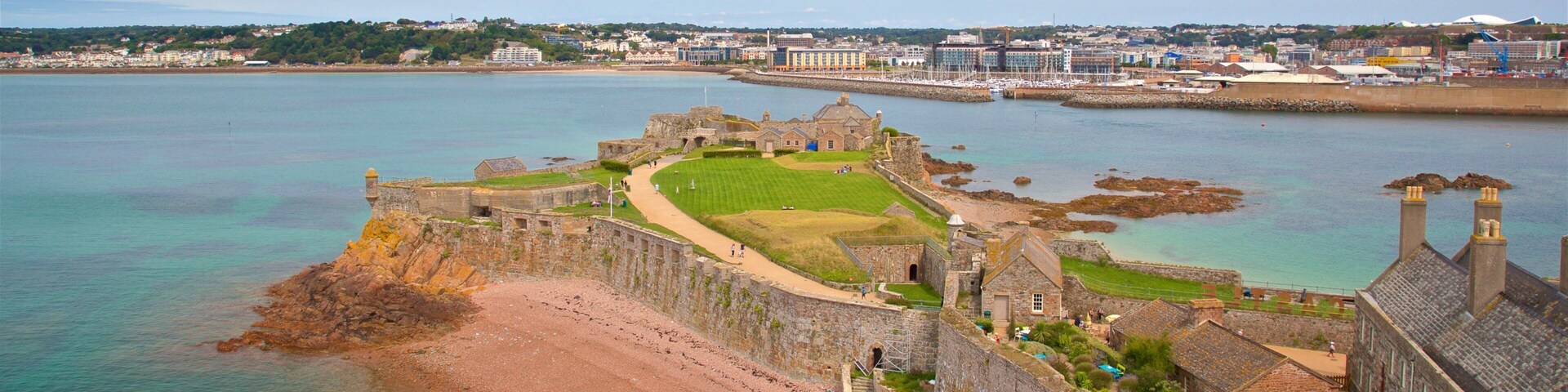 Elizabeth Castle which includes a coastal town and landscape views