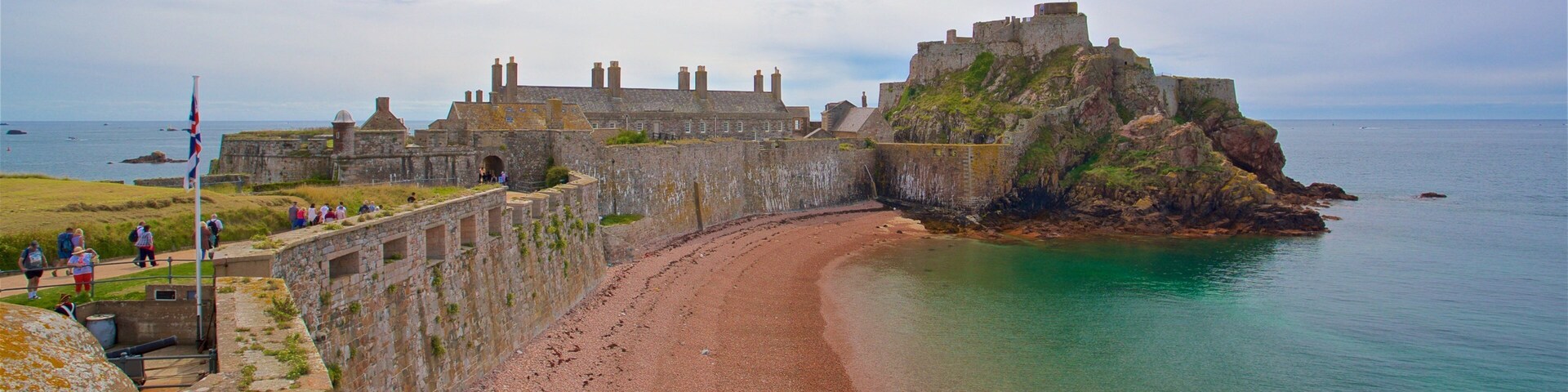 Elizabeth Castle featuring a beach, chateau or palace and general coastal views
