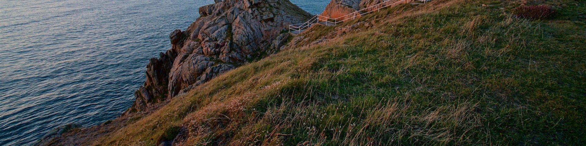 Grosnez Castle featuring a sunset, landscape views and general coastal views