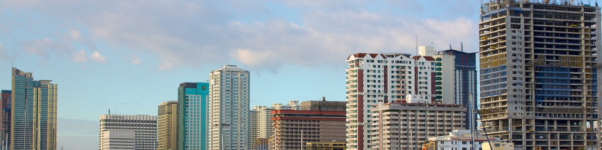 Baywalk which includes city views, boating and a marina