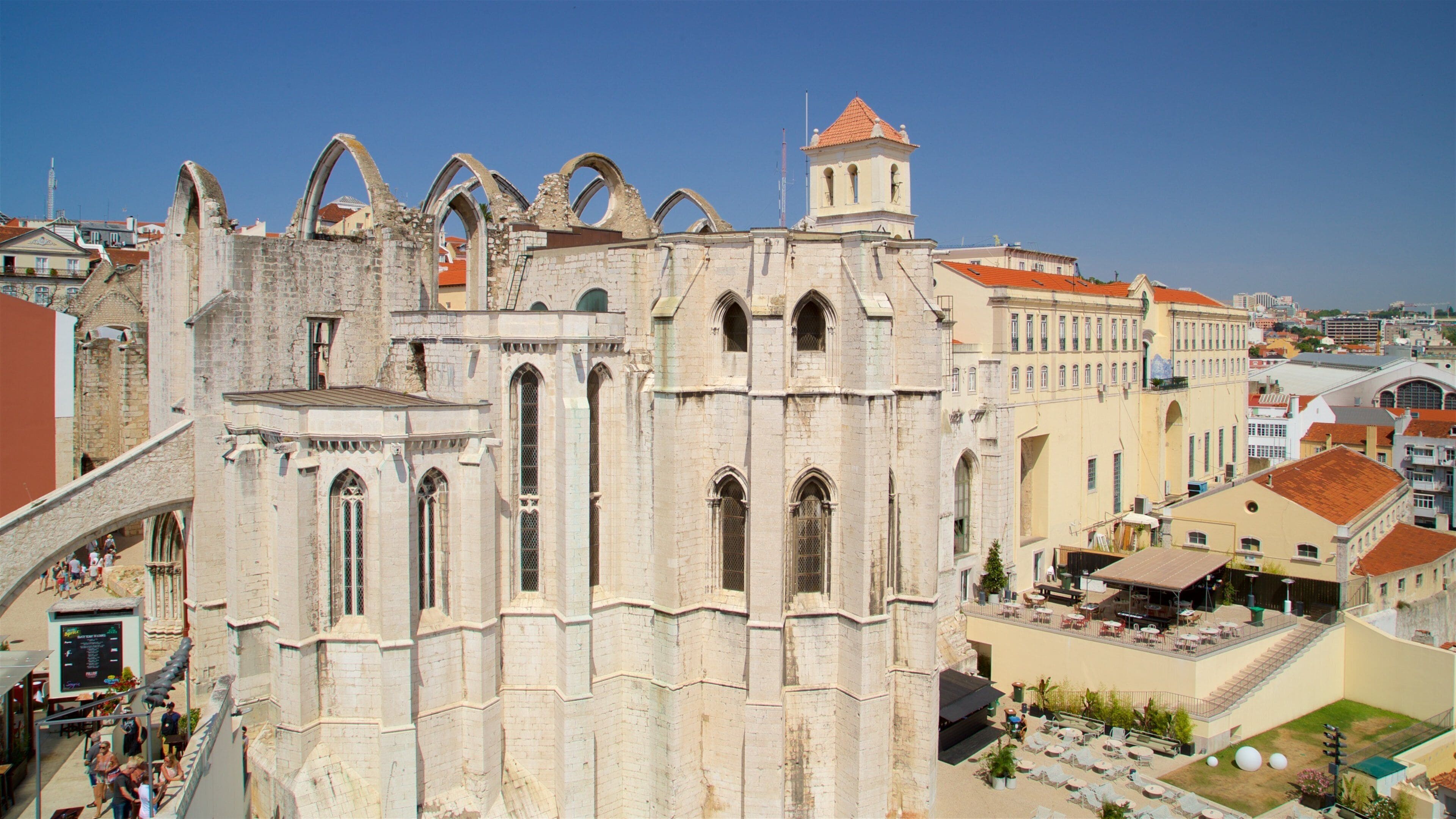 An old cathedral with arched windows and a bell tower.