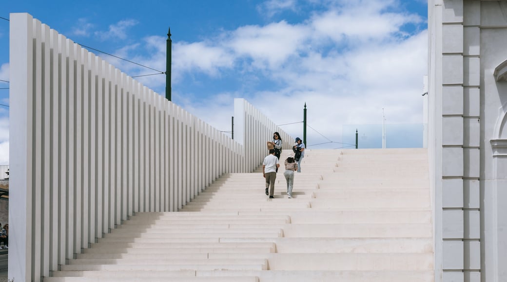 Ajuda National Palace showing street scenes as well as a couple