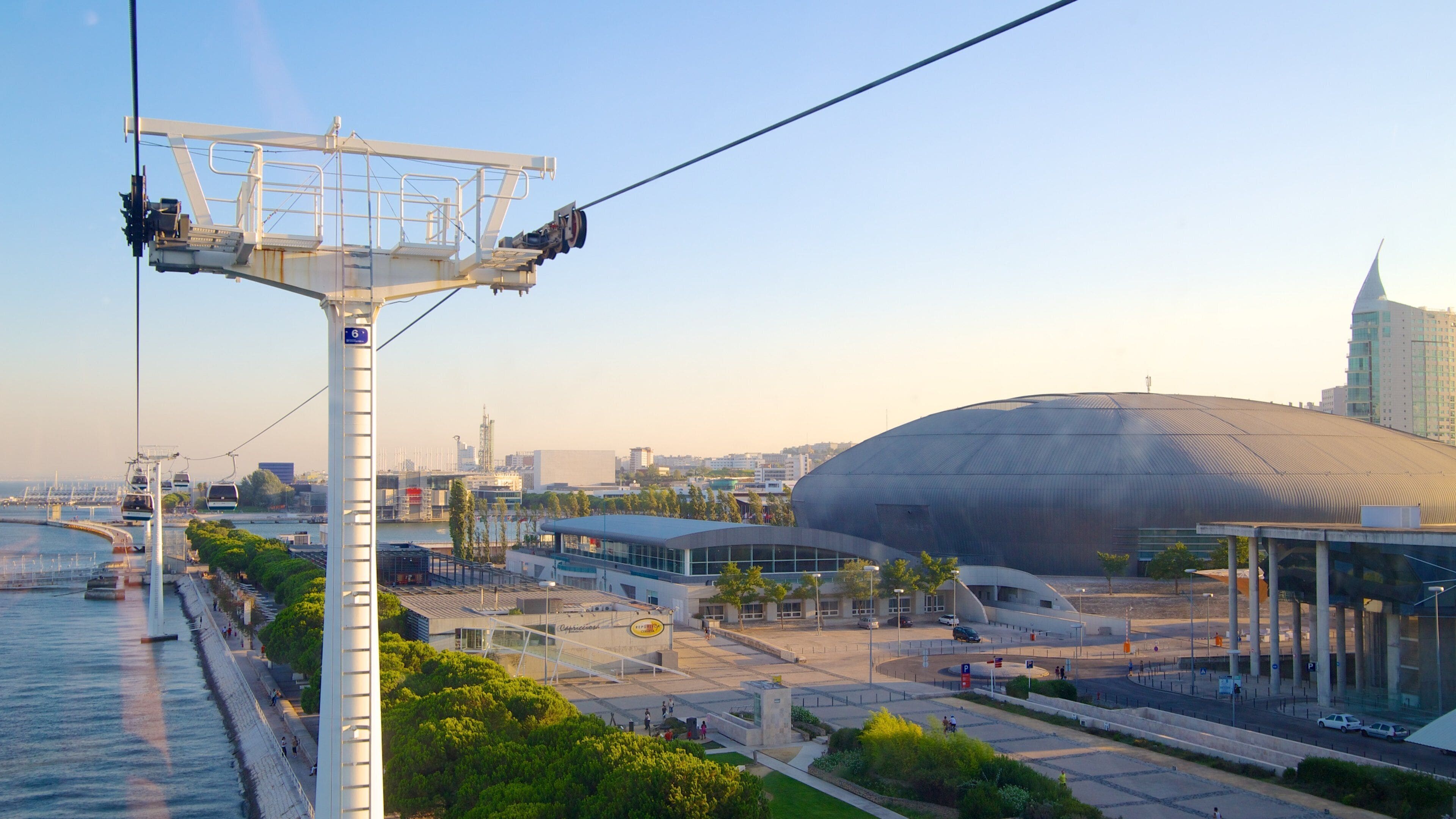 Vasco da Gama Bridge which includes a river or creek, modern architecture and a gondola