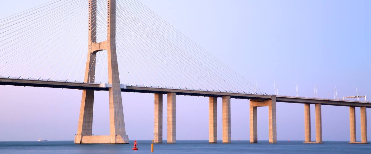 Vasco da Gama Bridge showing a river or creek, a bridge and modern architecture
