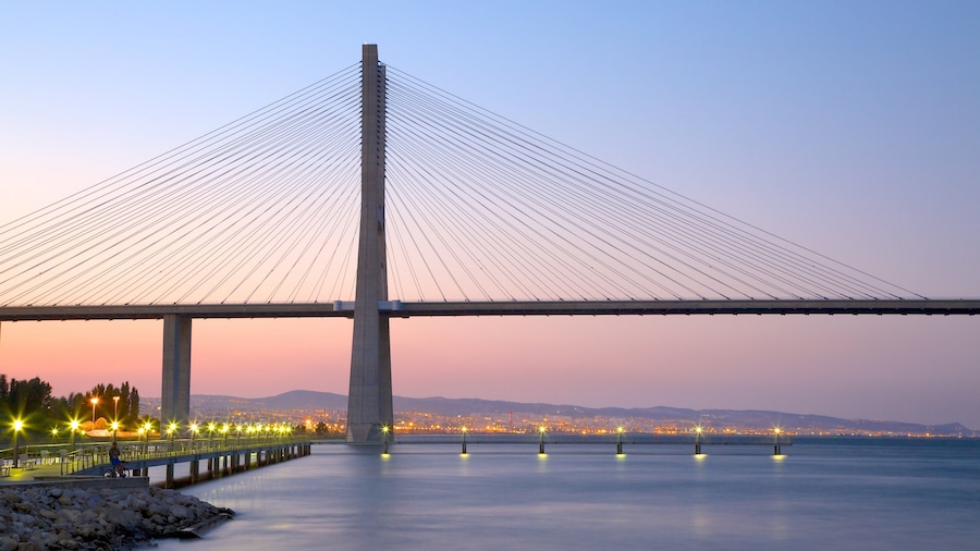 Vasco da Gama Bridge featuring a bridge, modern architecture and a sunset