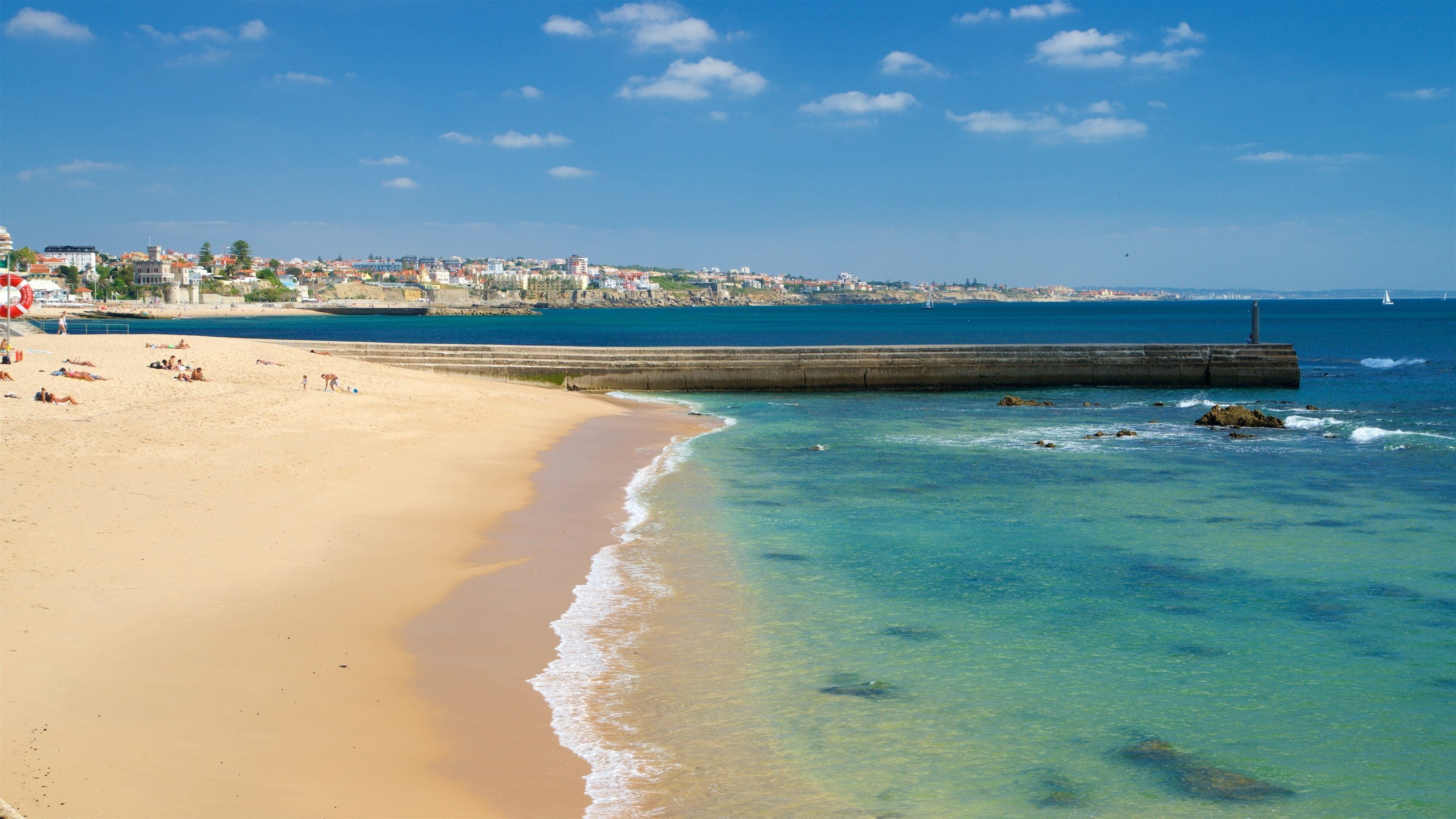 Tamariz Beach which includes a sandy beach and general coastal views