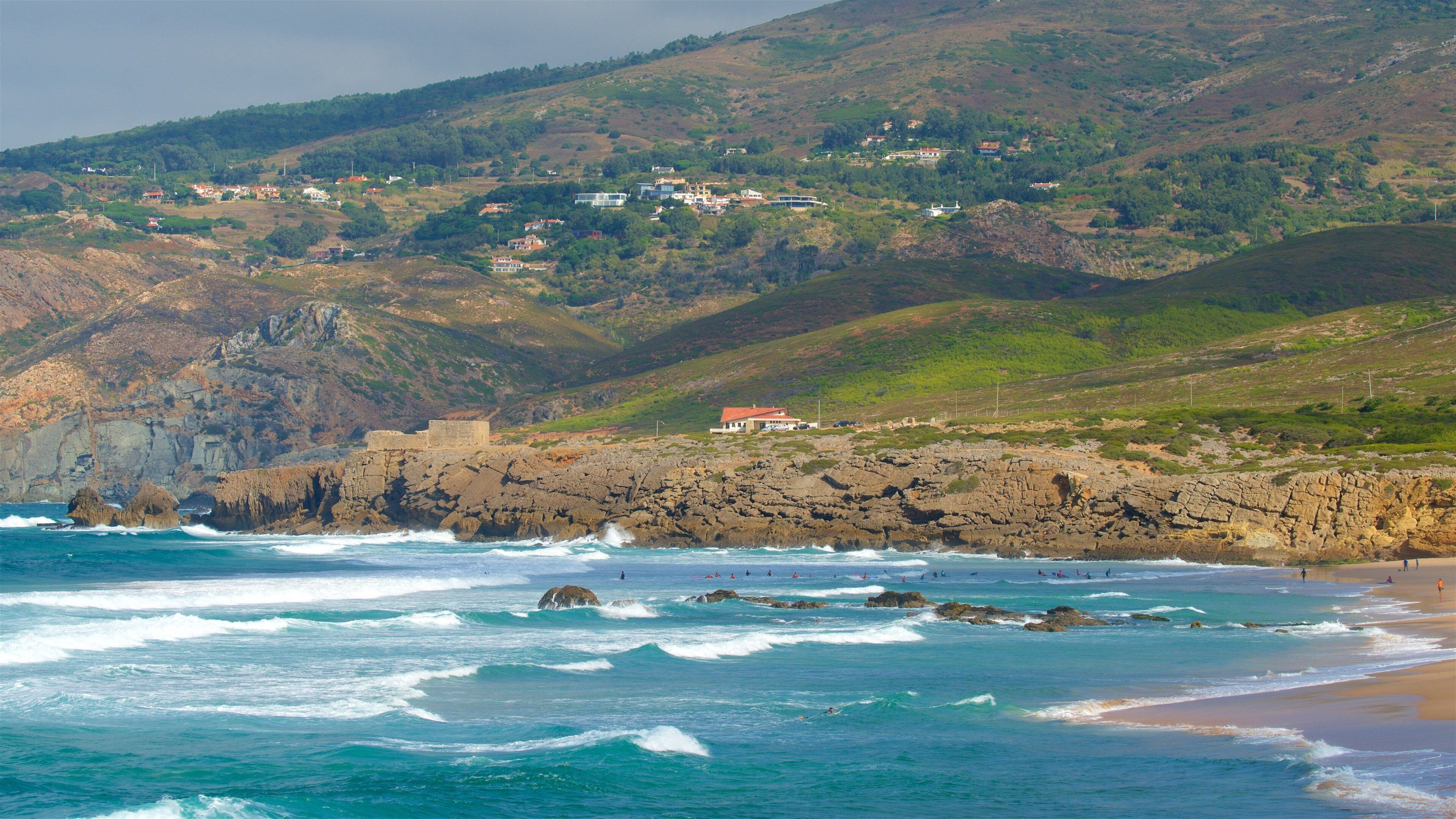Guincho Beach which includes tranquil scenes, rugged coastline and surf
