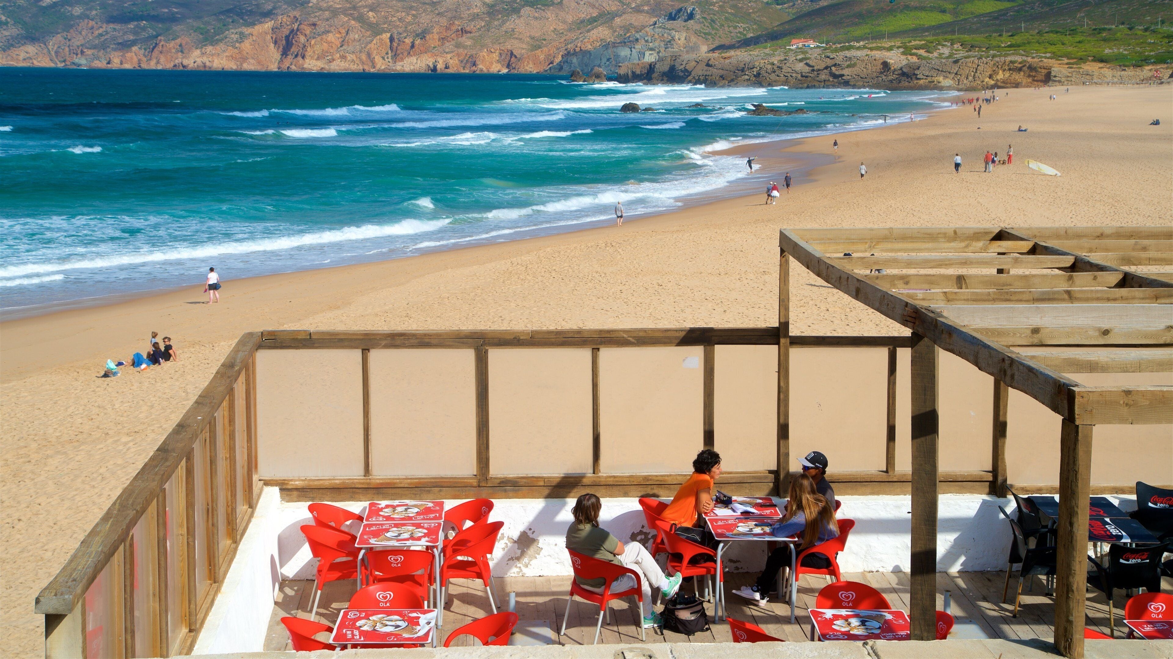 Guincho Beach showing a beach, outdoor eating and general coastal views