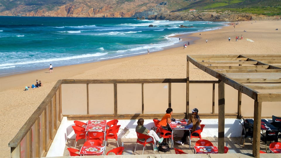 Guincho Beach showing a beach, outdoor eating and general coastal views