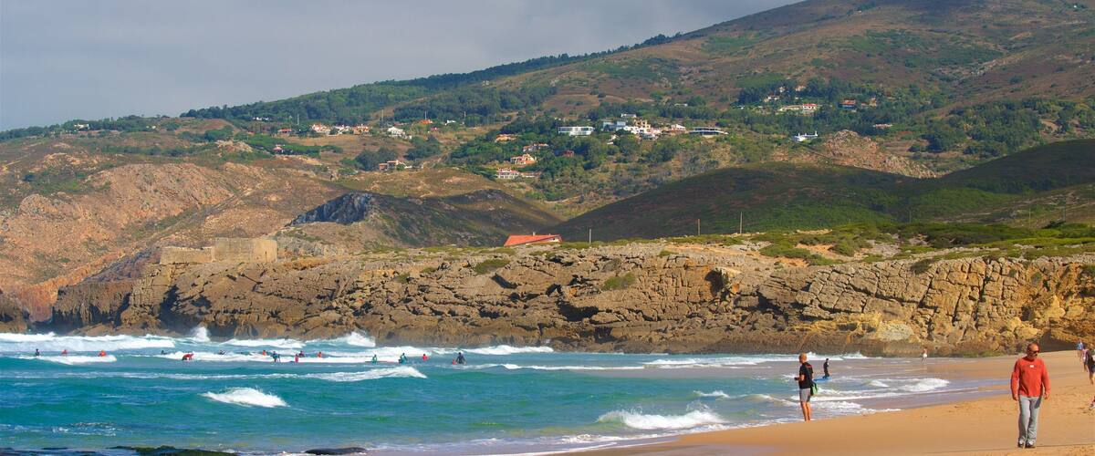 Guincho Beach which includes rocky coastline, tranquil scenes and a beach