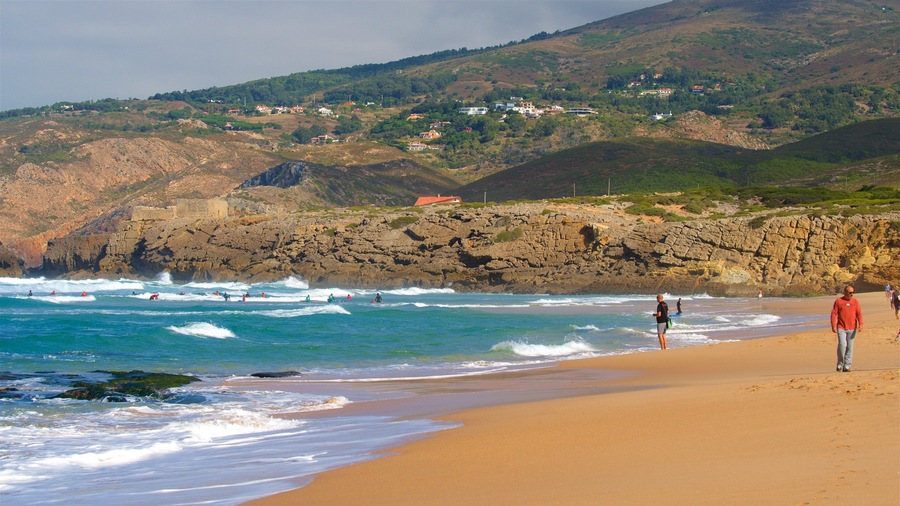 Guincho Beach featuring a sandy beach, tranquil scenes and rugged coastline