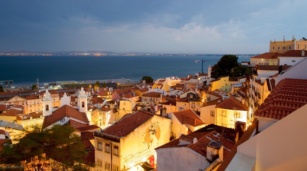 Miradouro de Santa Luzia which includes a coastal town and a lake or waterhole