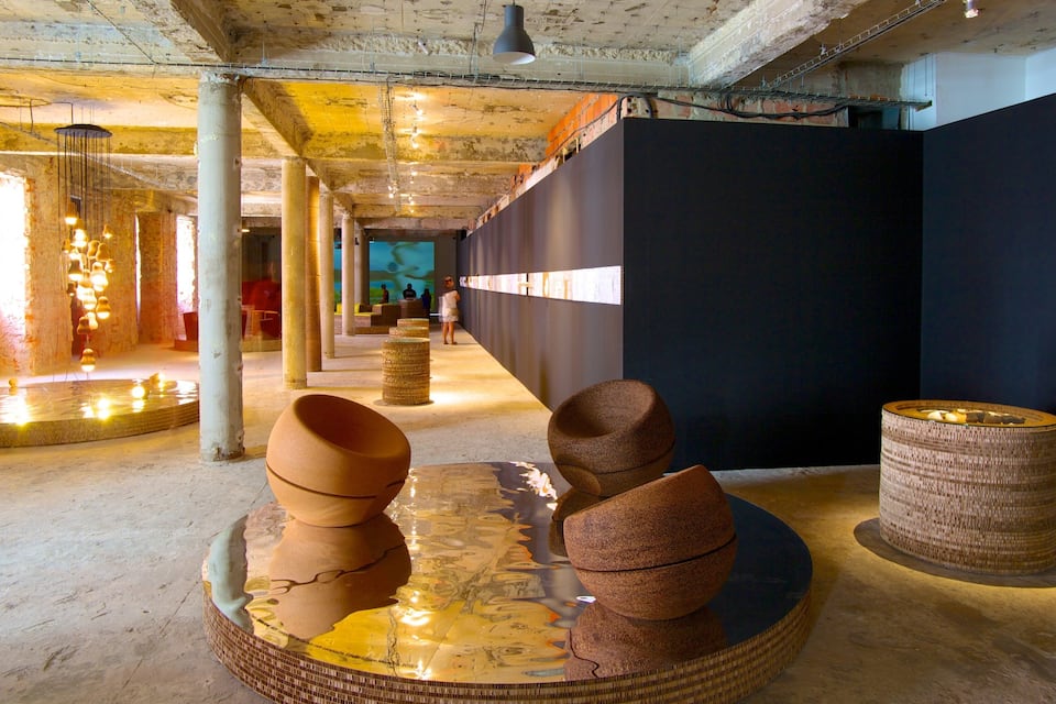 An art gallery with sculptures on display.