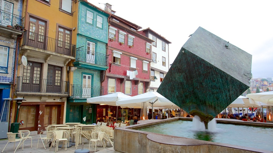Ribeira Square featuring a square or plaza, a monument and cafe lifestyle