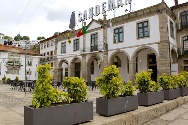 Sandeman Cellars featuring a square or plaza, signage and a small town or village