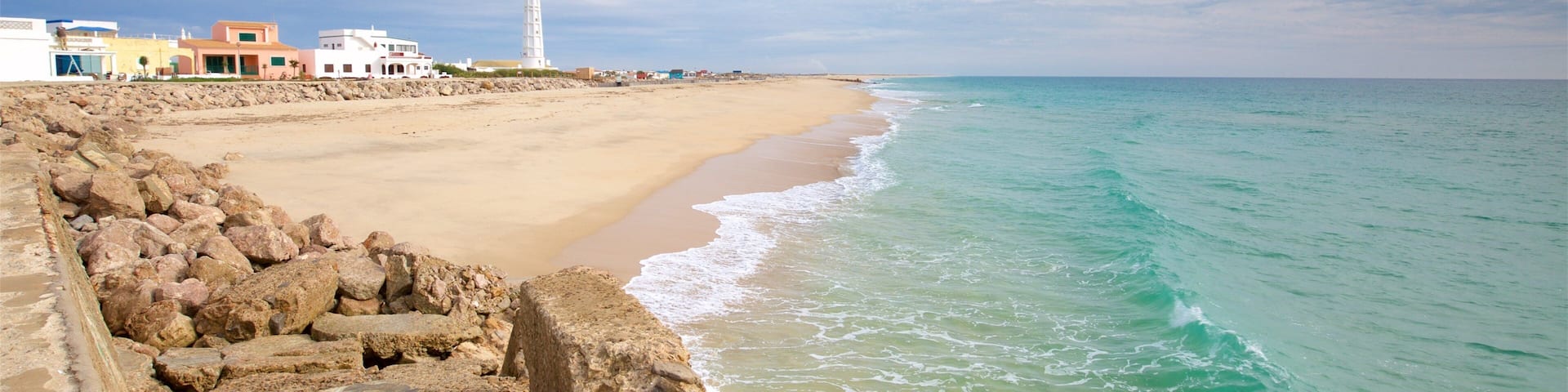 Faro Island Beach featuring a sandy beach and general coastal views