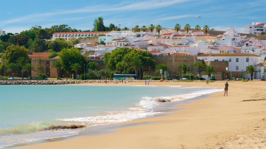 Meia Praia Beach which includes a sandy beach, a coastal town and general coastal views