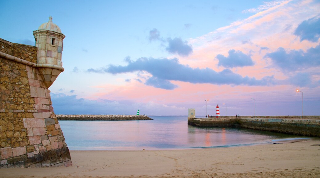 Lagos which includes a sunset, general coastal views and a sandy beach