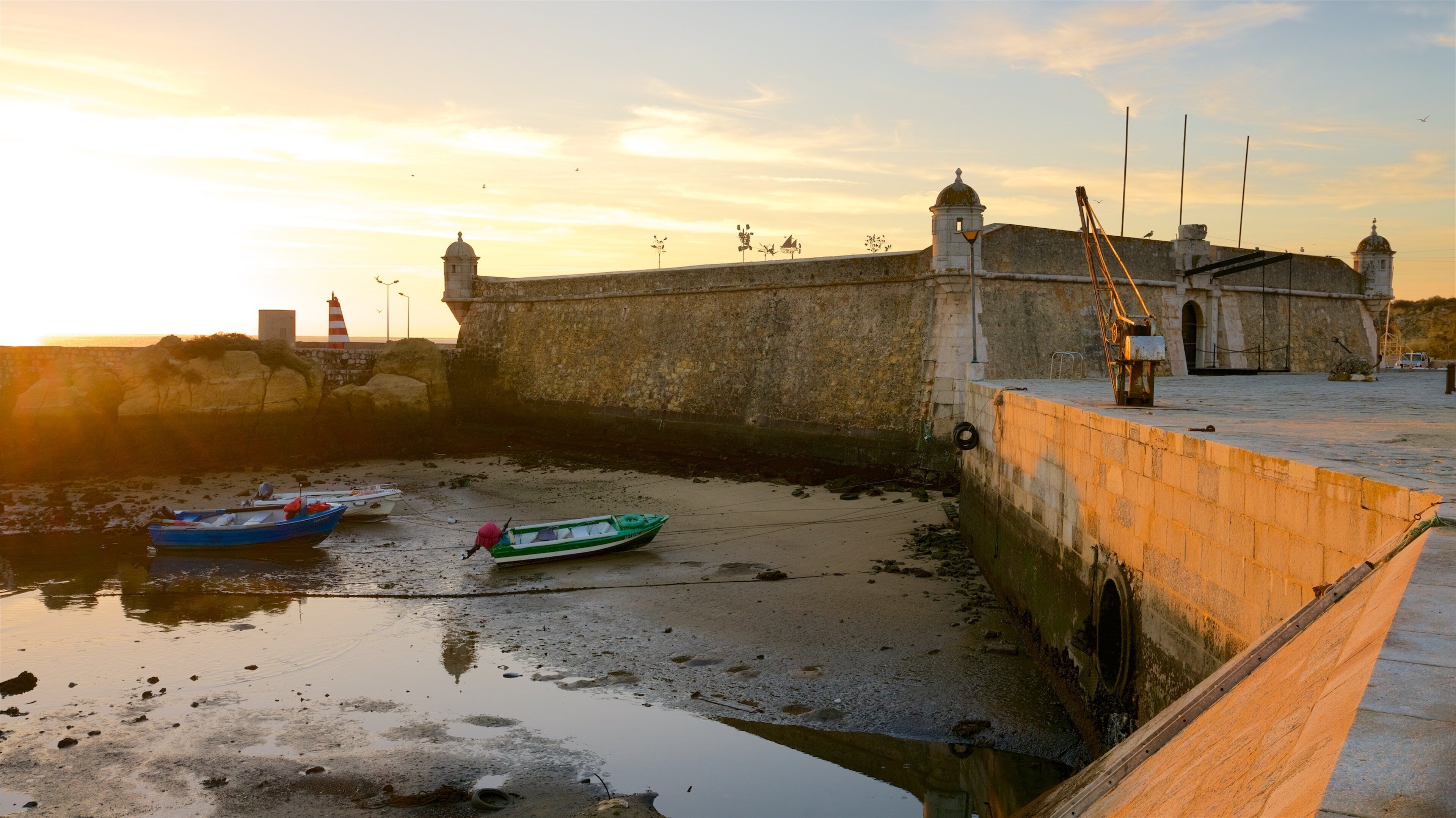 Lagos which includes a sunset and heritage elements