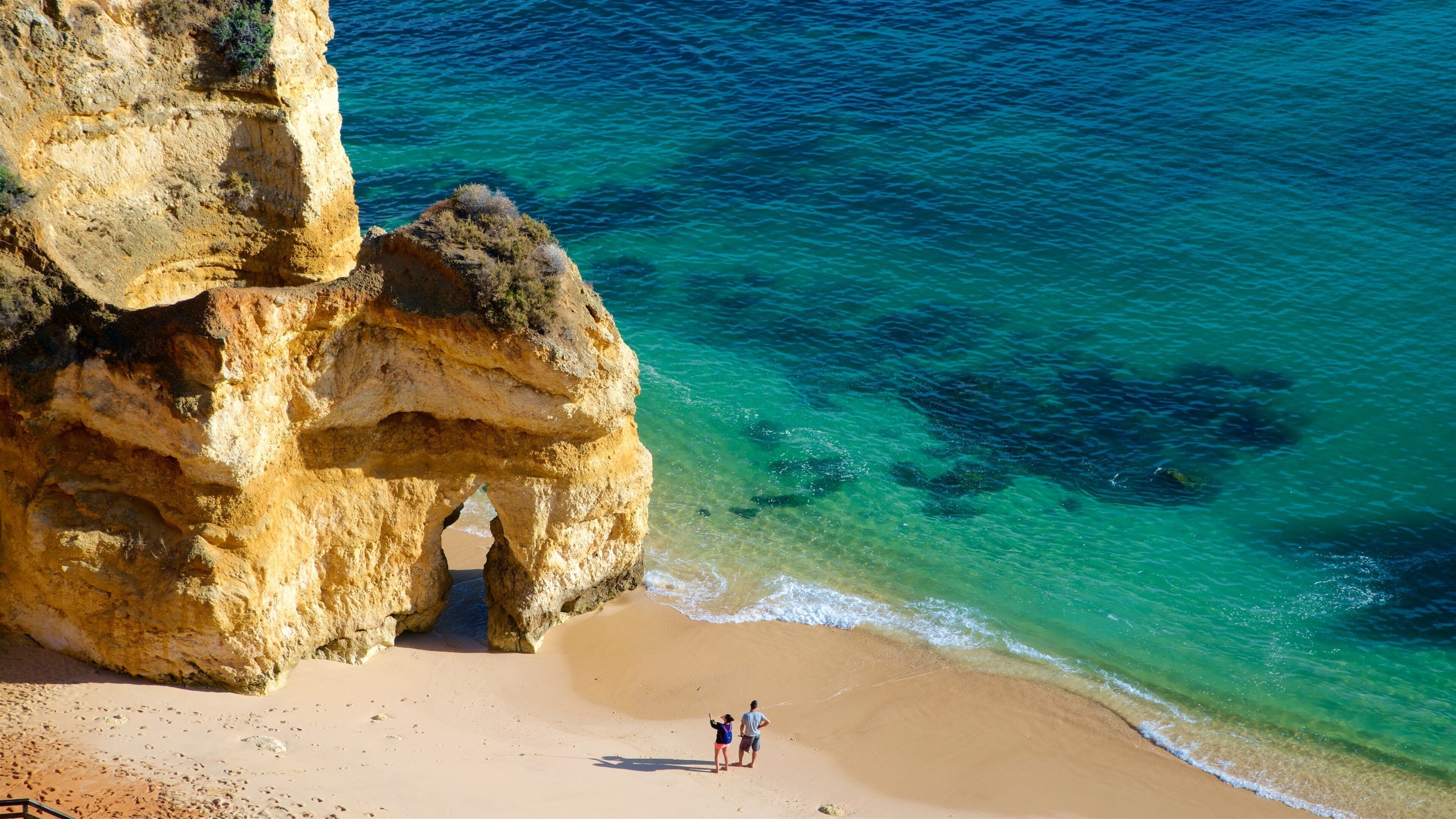 Camilo Beach featuring a sandy beach, rocky coastline and general coastal views