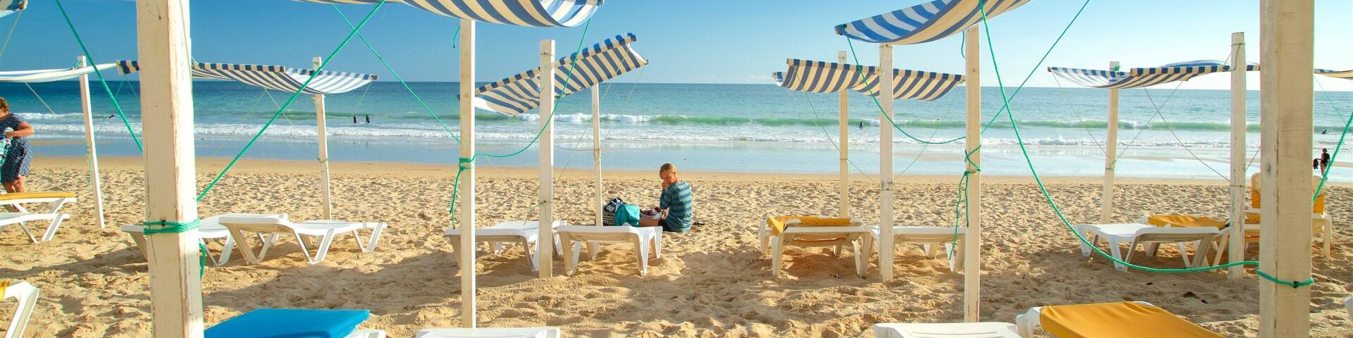 Porto de Mos Beach featuring a beach and general coastal views as well as an individual femail