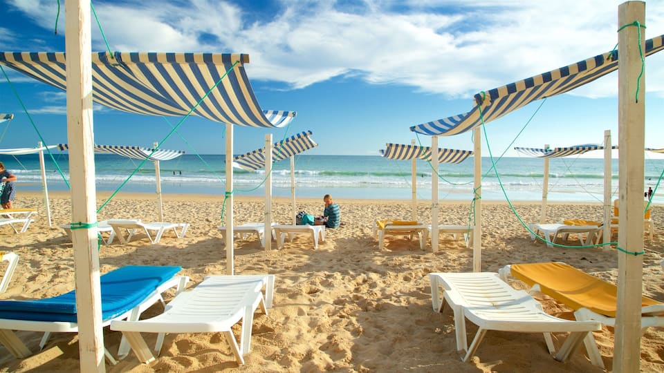 Porto de Mos Beach featuring a beach and general coastal views as well as an individual femail