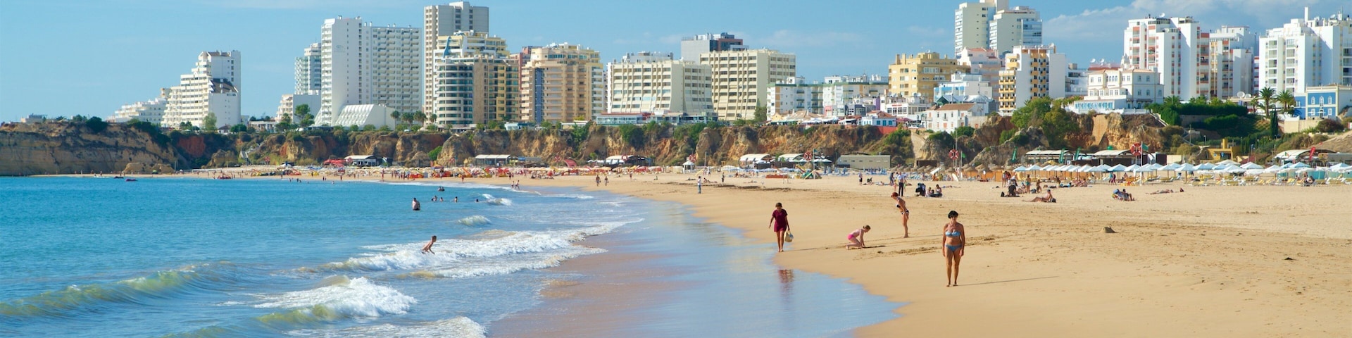 Rocha Beach showing a coastal town, general coastal views and a beach