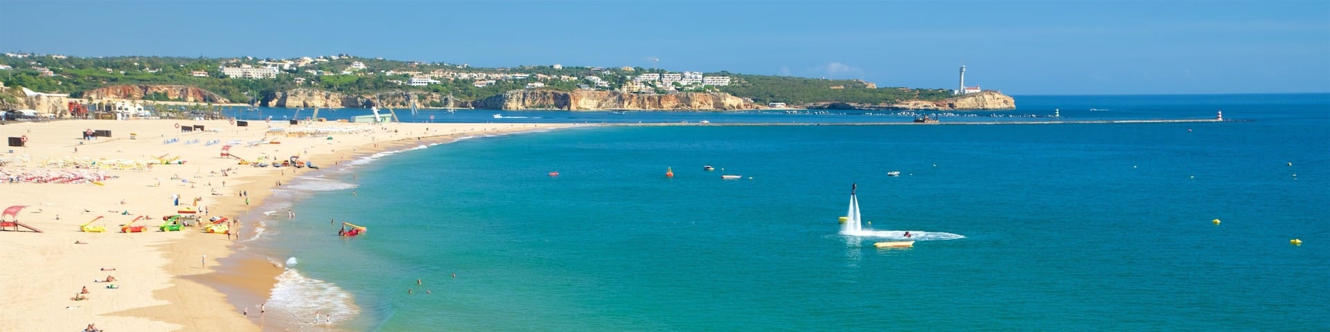 Strand Rocha welches beinhaltet allgemeine Küstenansicht und Sandstrand