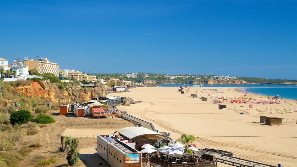 Rocha Beach showing a sandy beach, general coastal views and a coastal town
