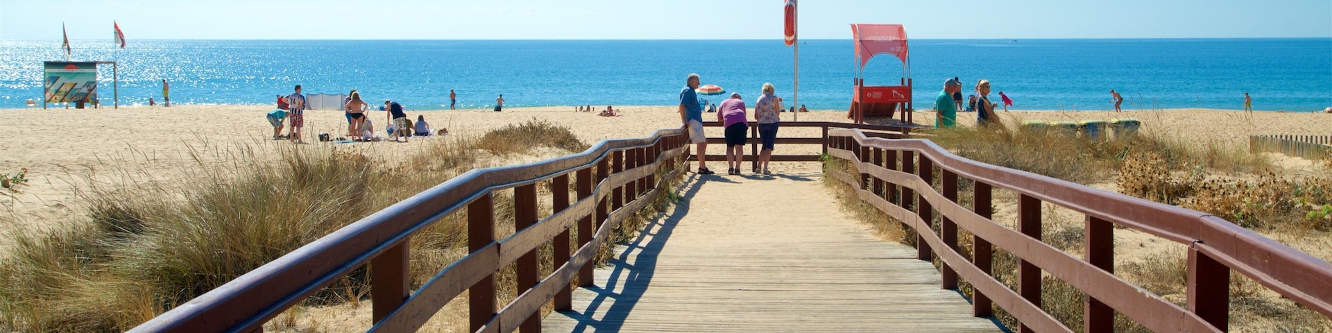 Alvor Beach featuring general coastal views, a bridge and a sandy beach